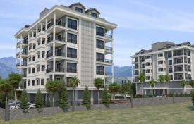 Различные апартаменты в новой качественной резиденции с бассейнами и садом, в 200 метрах от пляжа, Аланья, Турция за $233 000