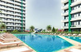 Двухкомнатные апартаменты в комплексе с бассейном и спортивными площадками, 1 км до моря и пляжей, Мерсин, Турция за От $66 000