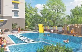 Новые квартиры с балконами в охраняемой резиденции с бассейнами, садом и аквапарком, в 120 метрах от пляжа, Махмутлар, Турция за $289 000