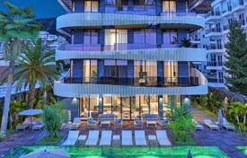 Новая квартира с балконом в резиденции на берегу моря с бассейном, садом и парковкой, Кестель, Турция. Цена по запросу